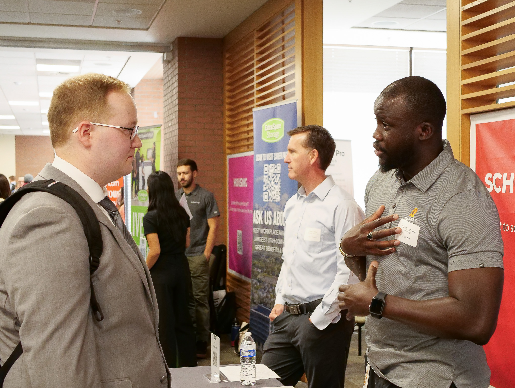 A student and employer representative speaking at a Career Fair